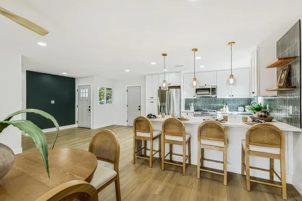 a view of a dining room with furniture and wooden floor