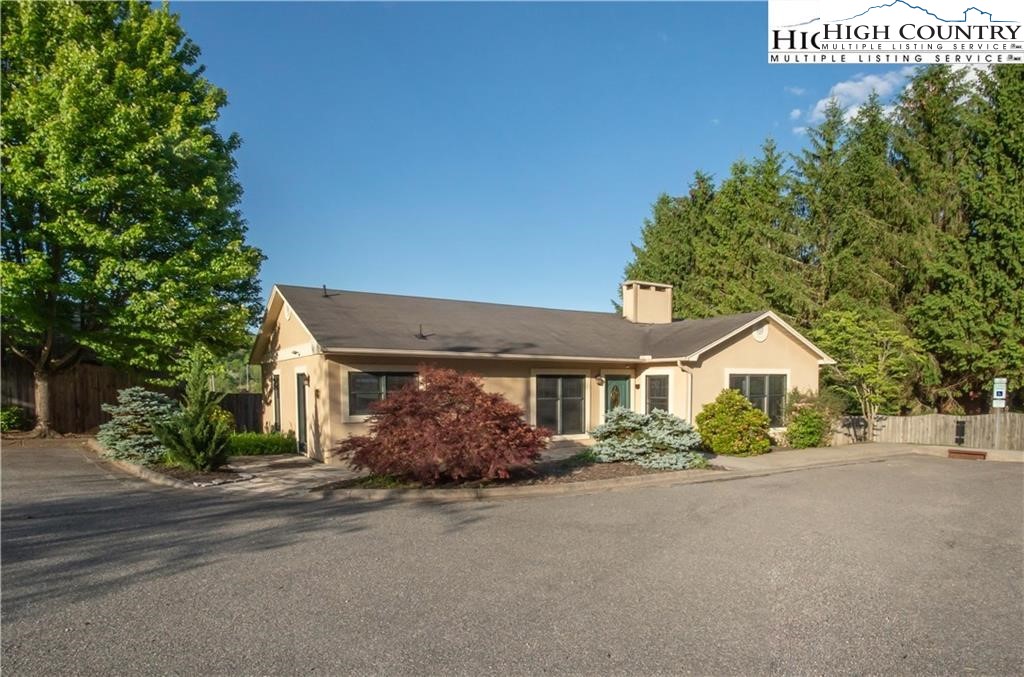 140 Gateway Drive, Unit 302 Boone, NC 28607 - Photo 11 of 30 a front view of a house with a yard