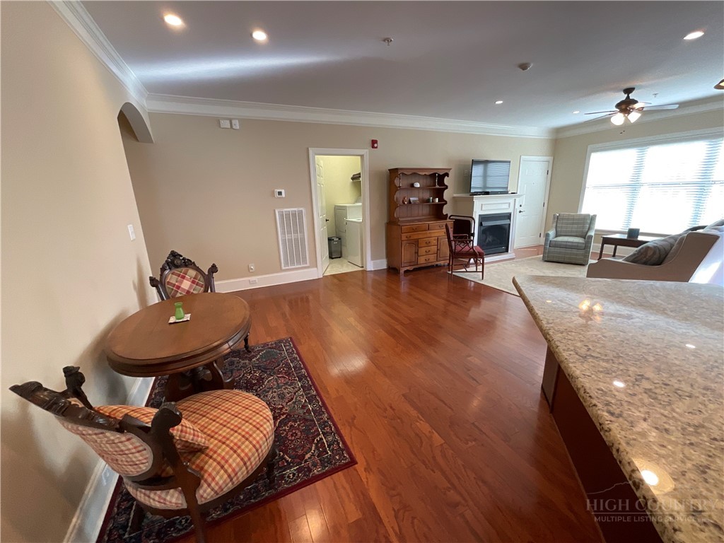 140 Gateway Drive, Unit 302 Boone, NC 28607 - Photo 14 of 30 a living room with furniture and a wooden floor