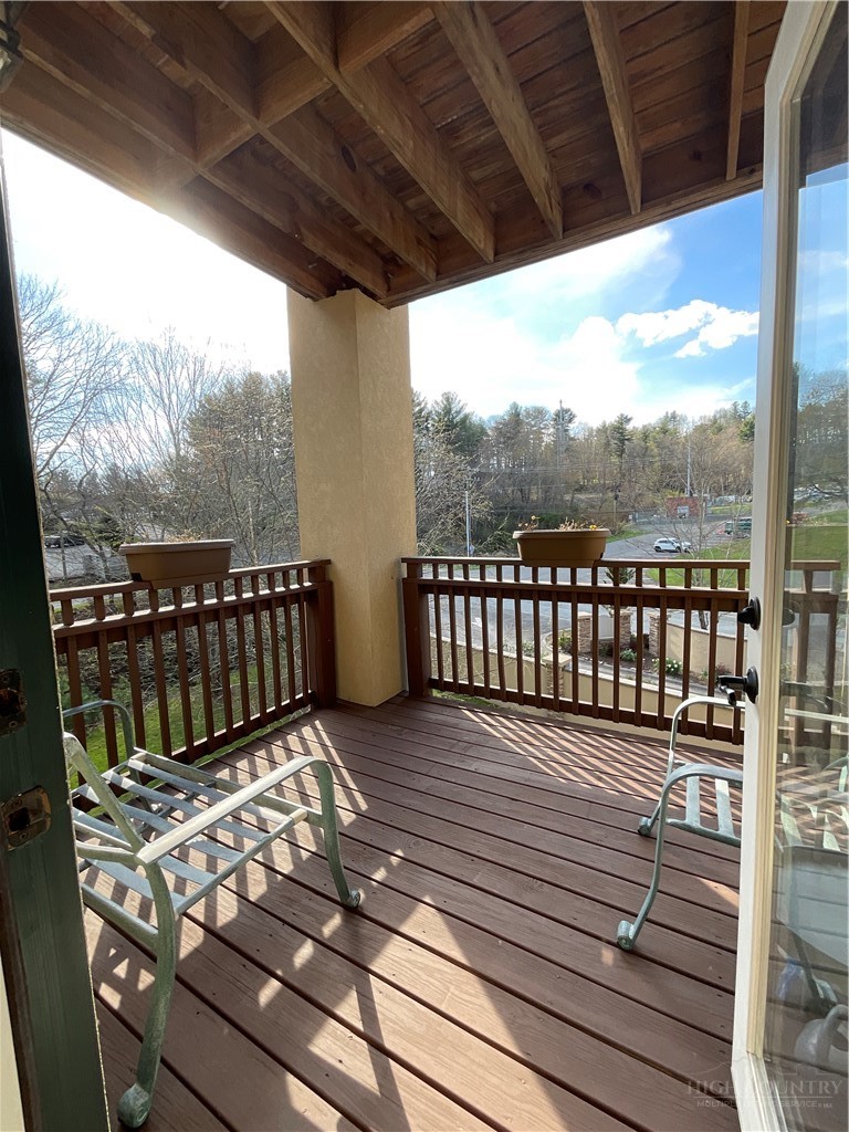 140 Gateway Drive, Unit 302 Boone, NC 28607 - Photo 18 of 30 a view of a roof deck with wooden floor