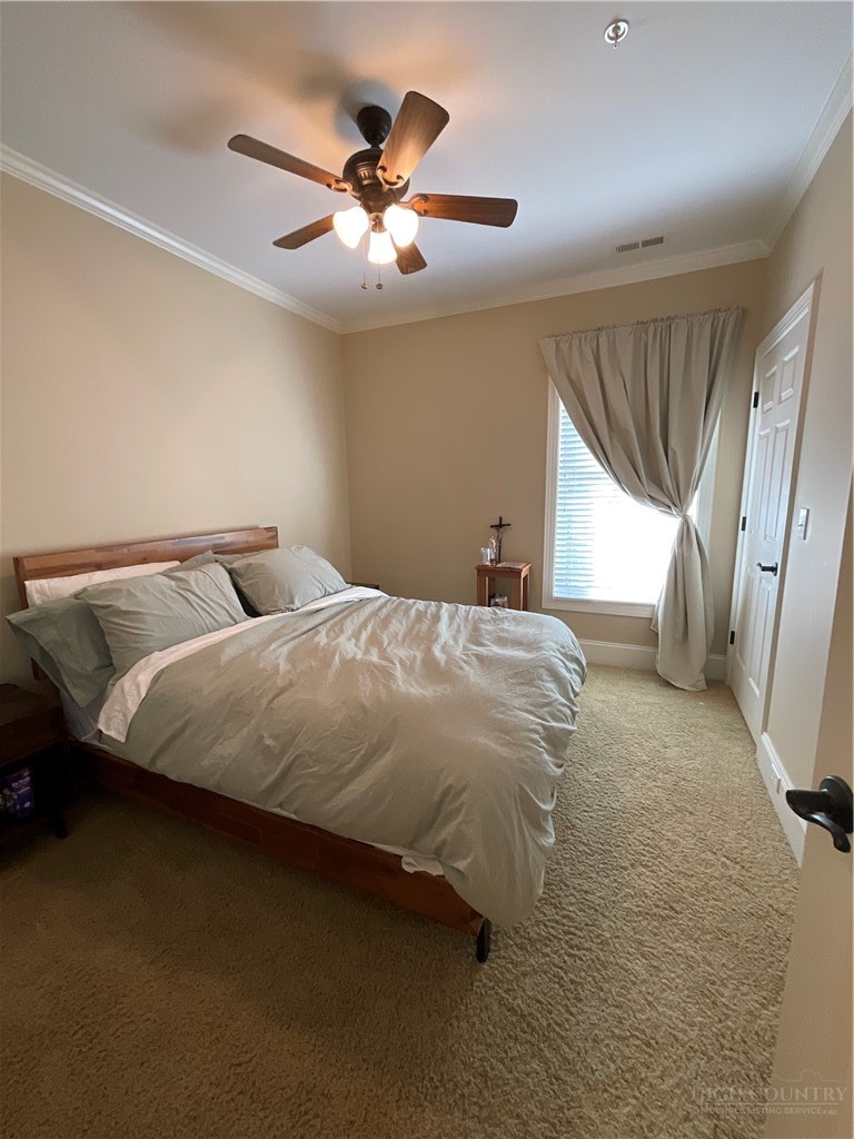 140 Gateway Drive, Unit 302 Boone, NC 28607 - Photo 25 of 30 a bedroom with a bed and window