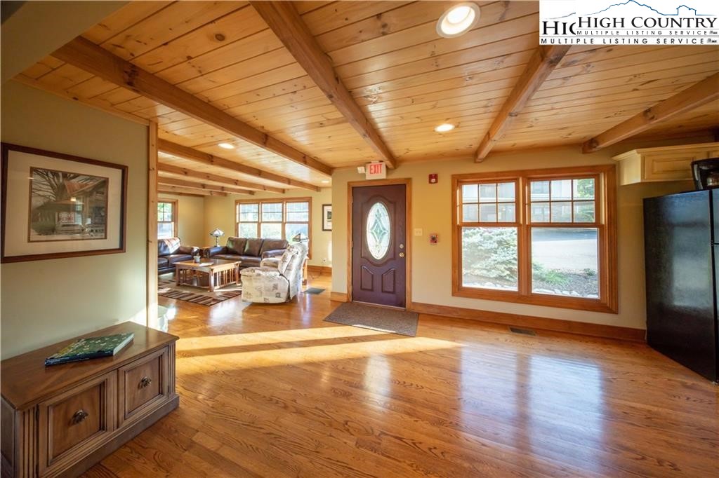 140 Gateway Drive, Unit 302 Boone, NC 28607 - Photo 28 of 30 a living room with fireplace furniture and a large window