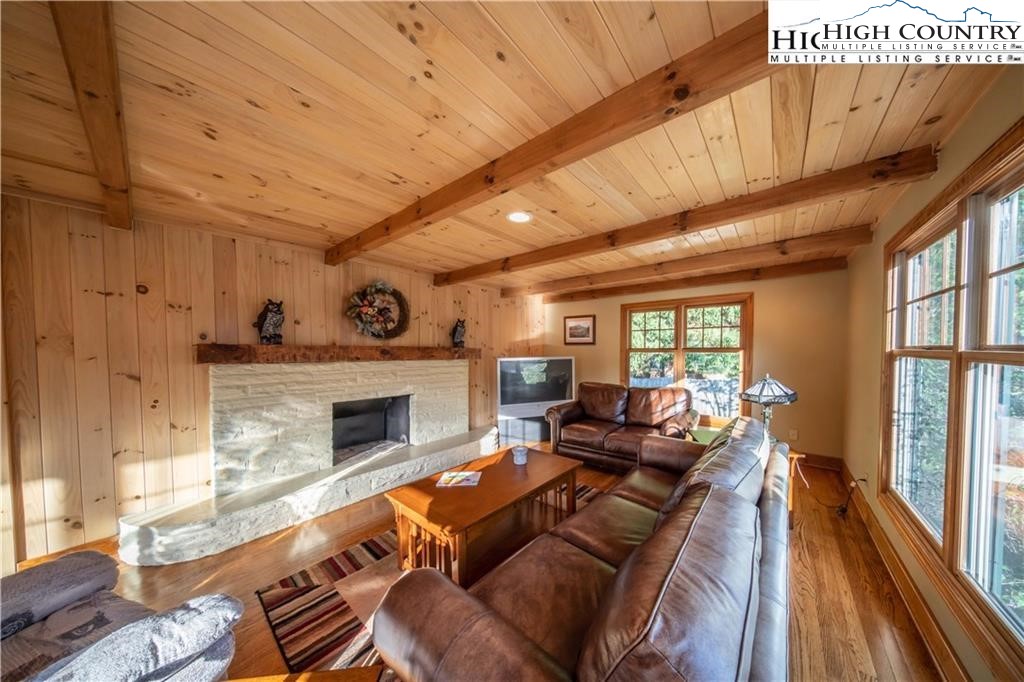 140 Gateway Drive, Unit 302 Boone, NC 28607 - Photo 30 of 30 a living room with furniture a fireplace and a table