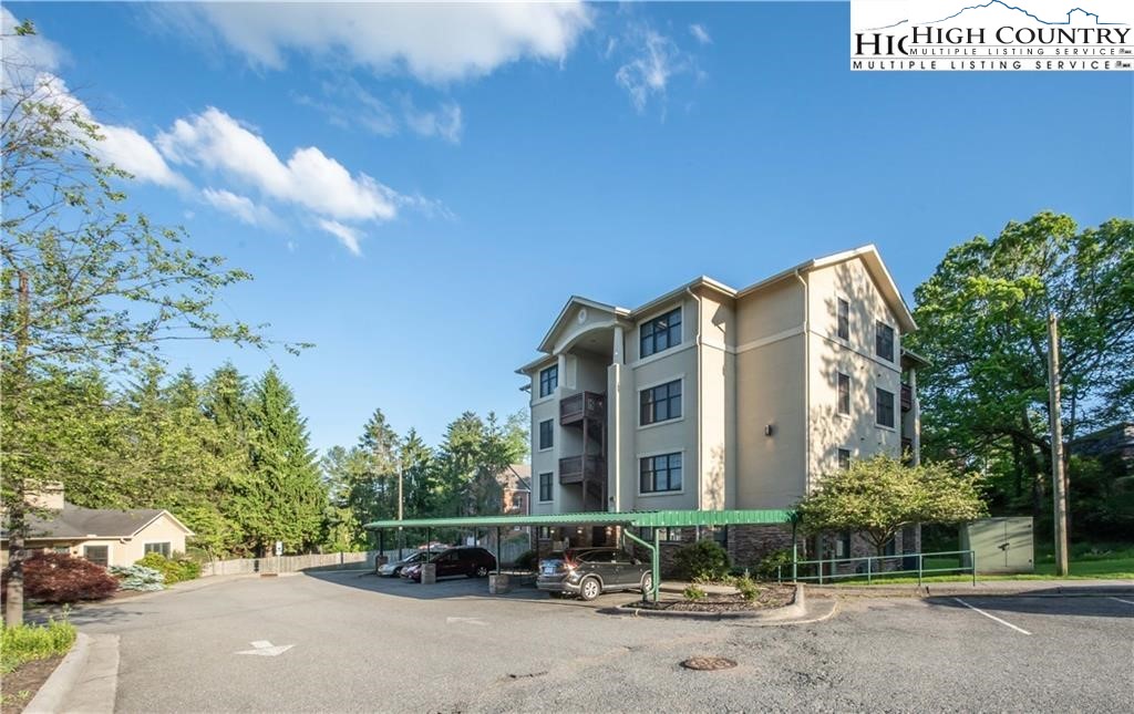 140 Gateway Drive, Unit 302 Boone, NC 28607 - Photo 6 of 30 a car parked in front of a building