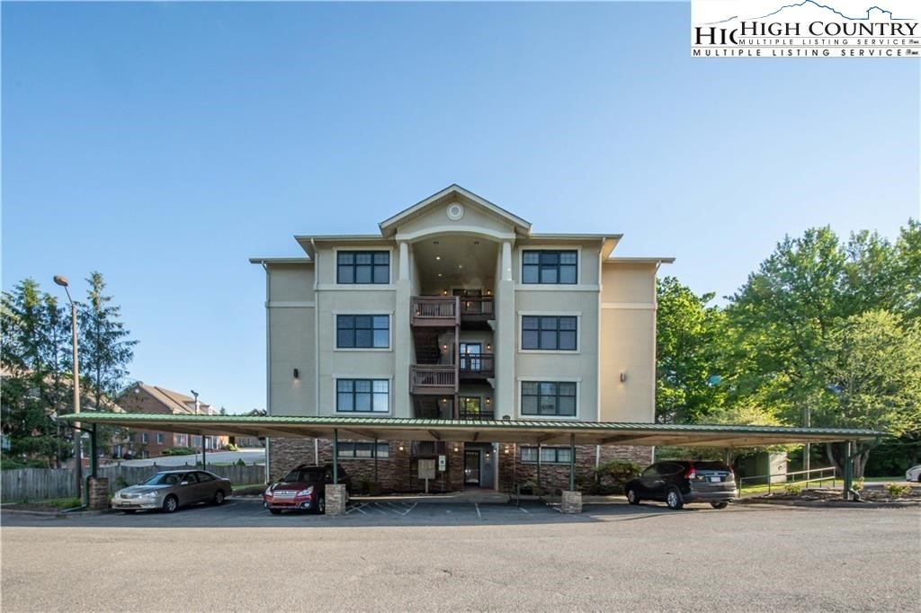 140 Gateway Drive, Unit 302 Boone, NC 28607 - Photo 7 of 30 a car parked in front of a building