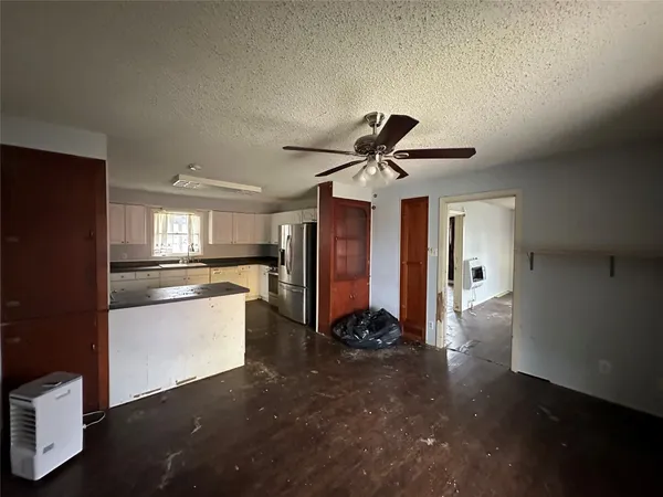 a kitchen with counter top space and appliances