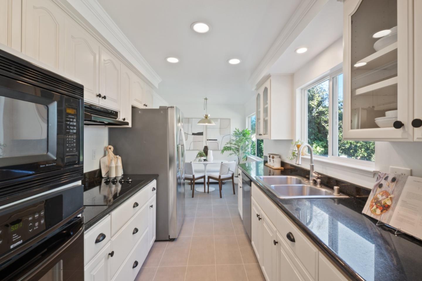 7453 Interlachen Avenue San Ramon, CA 94583 - Photo 11 of 35 a kitchen with granite countertop lots of counter top space and stainless steel appliances