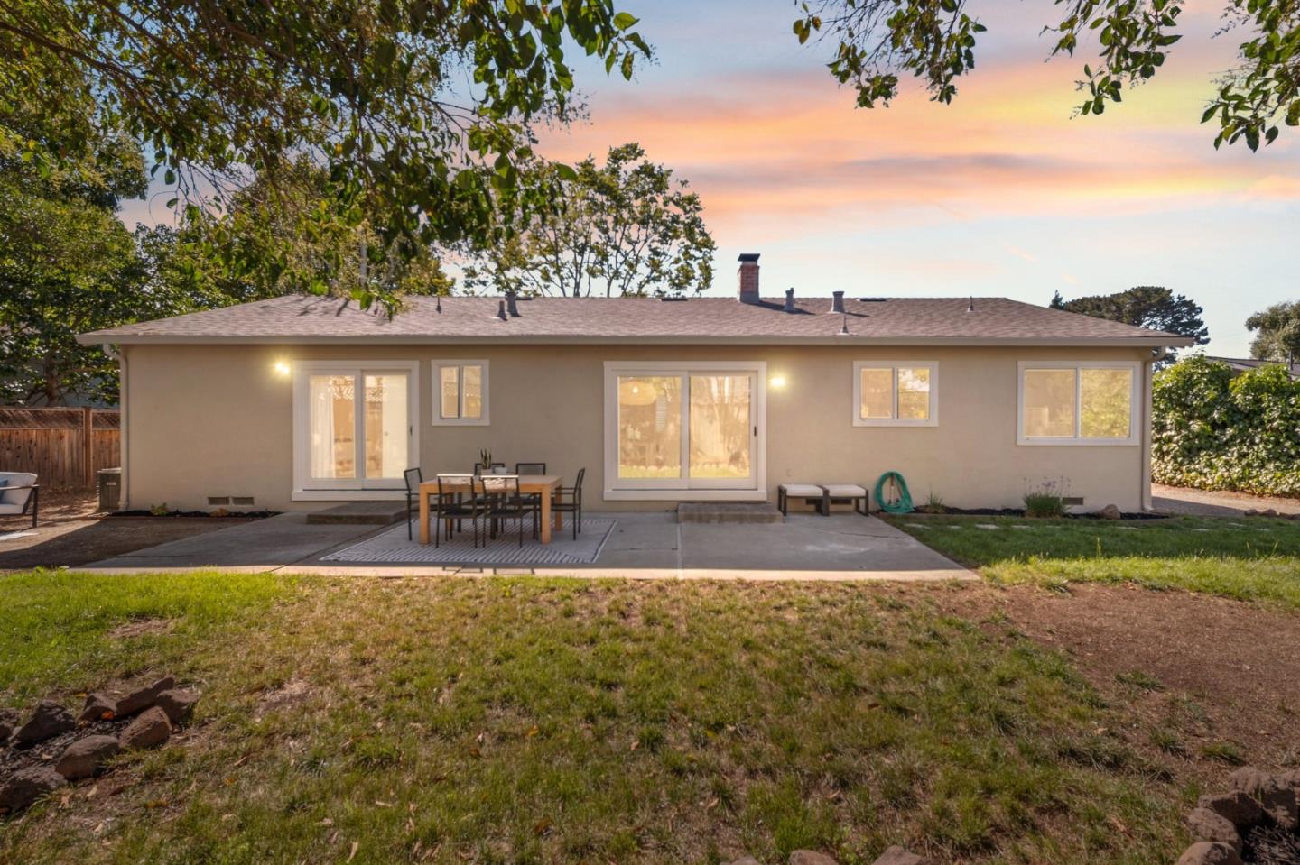 7453 Interlachen Avenue San Ramon, CA 94583 - Photo 21 of 35 a view of backyard of house with outdoor seating and covered with trees