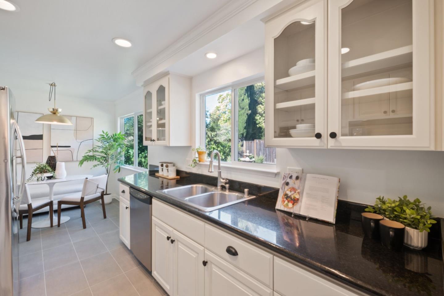 7453 Interlachen Avenue San Ramon, CA 94583 - Photo 9 of 35 a kitchen with a potted plant on the counter and cabinets