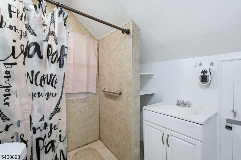 78 South Devine Street Newark, NJ 07106 - Photo 16 of 24 a bathroom with a shower and a sink