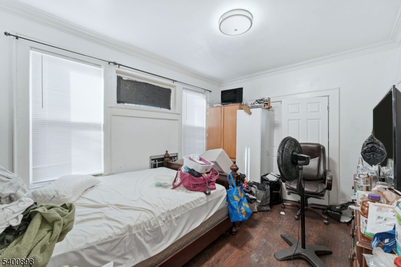 78 South Devine Street Newark, NJ 07106 - Photo 20 of 24 a bedroom with a bed and a window