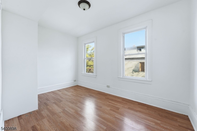 78 South Devine Street Newark, NJ 07106 - Photo 5 of 24 an empty room with windows