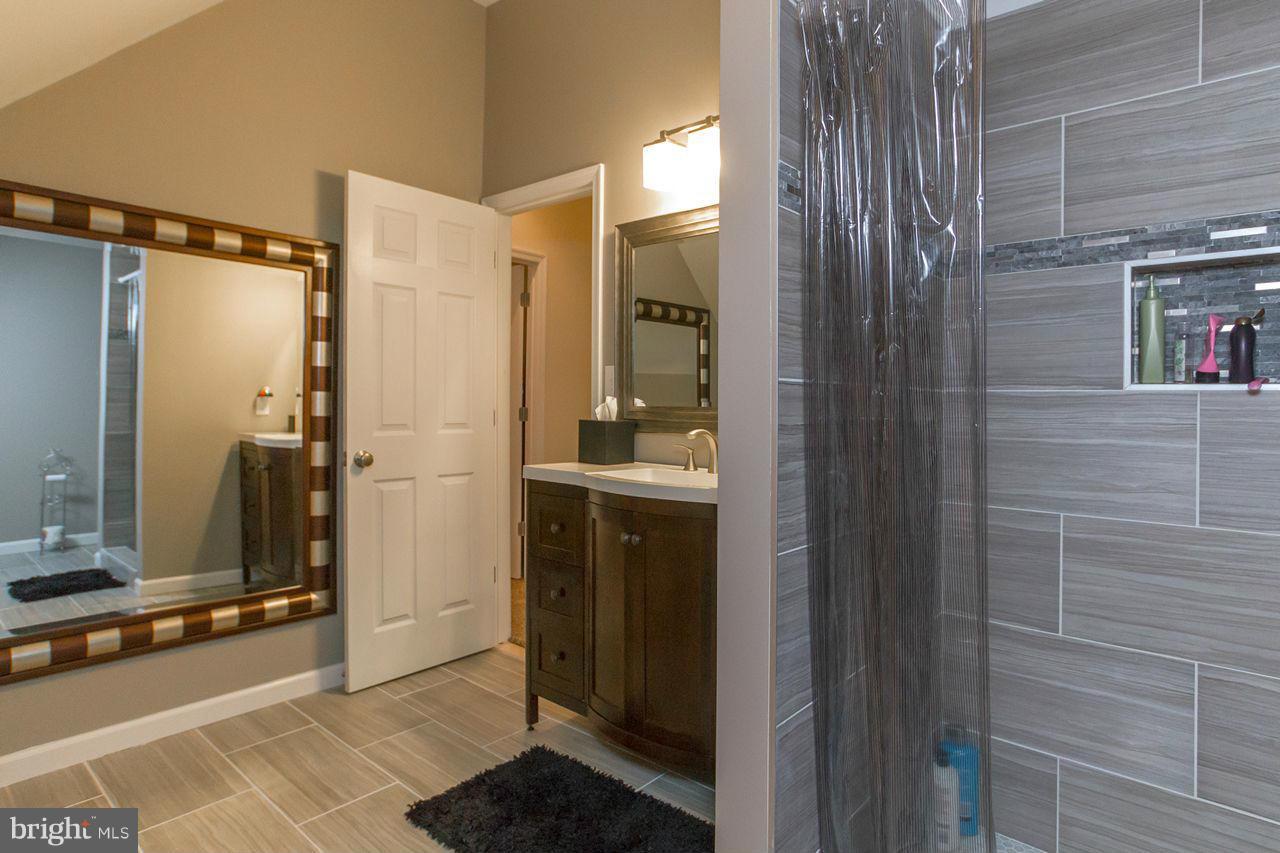2223 Corbett Road Monkton, MD 21111 - Photo 22 of 30 a bathroom with a shower and a sink