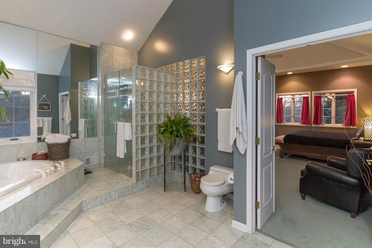 2223 Corbett Road Monkton, MD 21111 - Photo 7 of 30 a bathroom with a bathtub shower sink and toilet