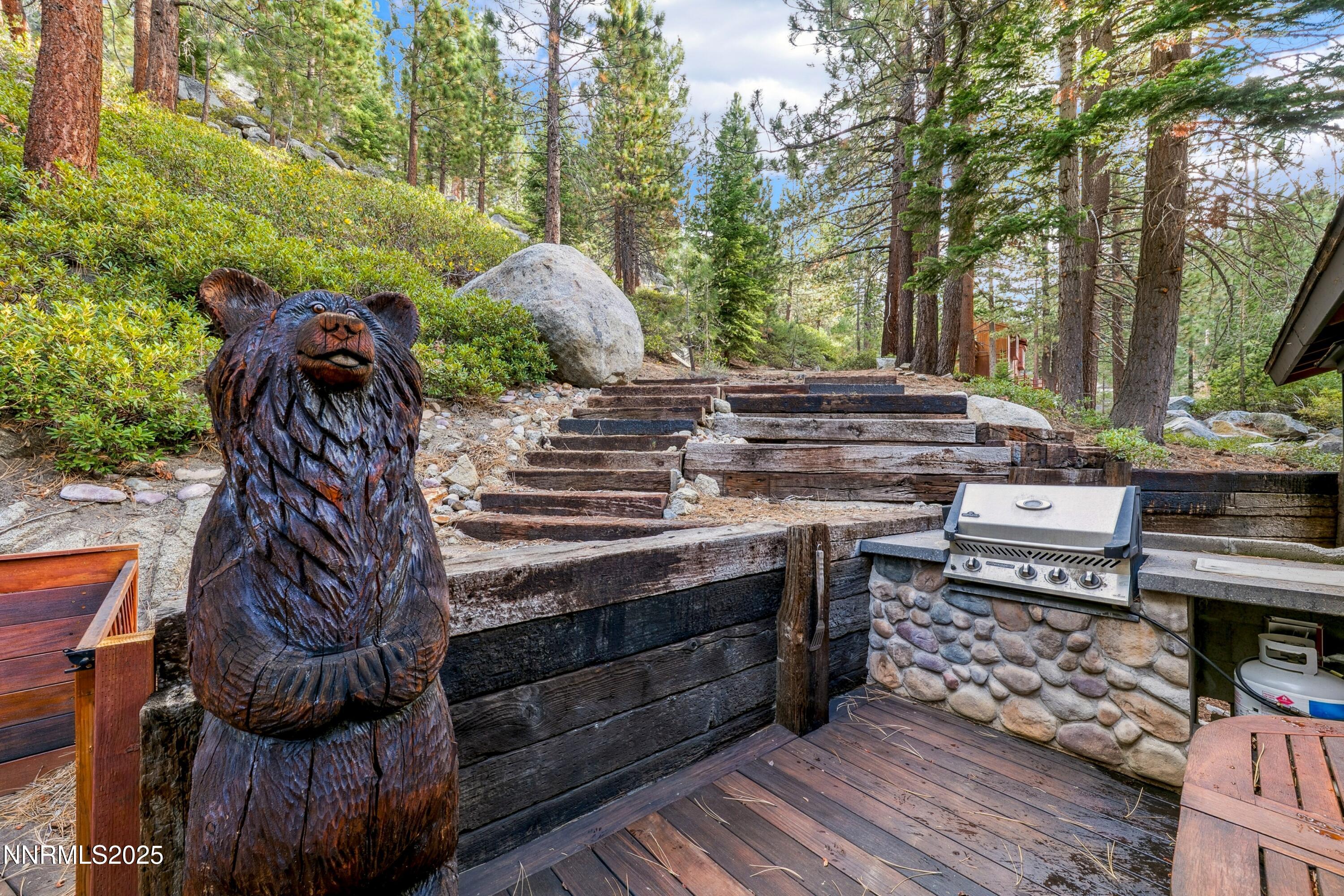 134 Aspen Way Stateline, NV 89449 - Photo 21 of 25 a view of a patio with table and chairs with wooden floor and fence