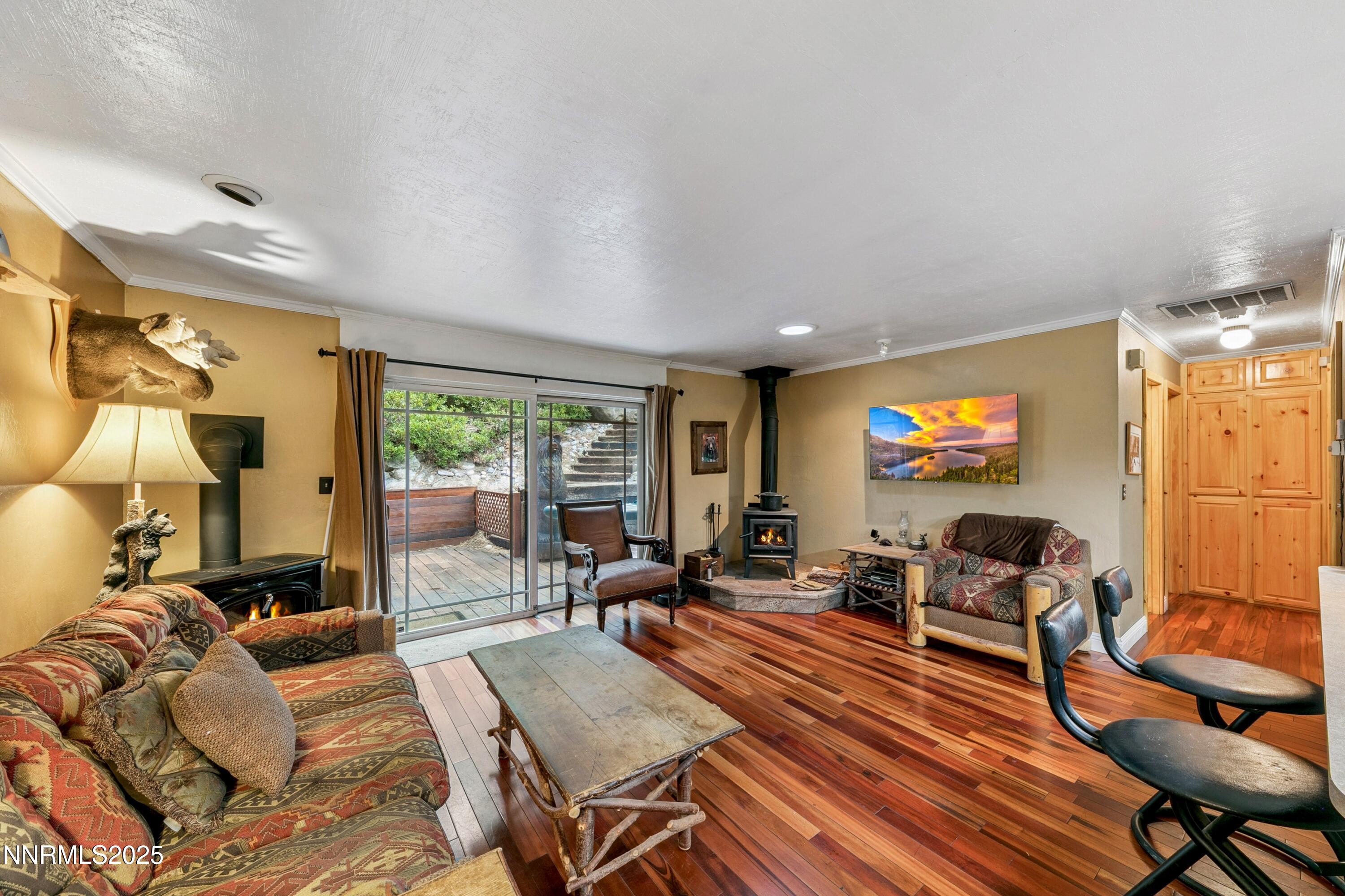134 Aspen Way Stateline, NV 89449 - Photo 3 of 25 a living room with furniture and a flat screen tv