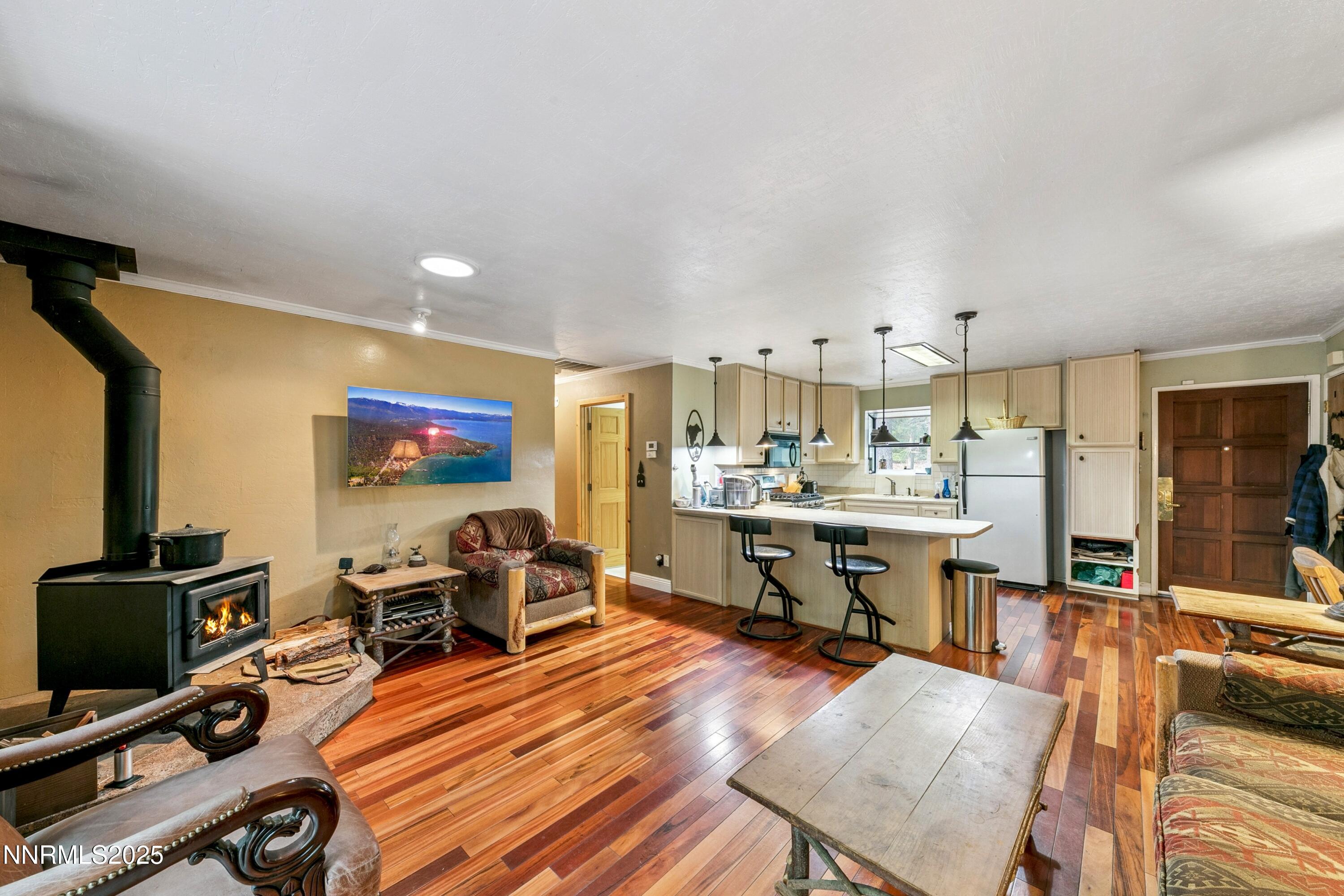 134 Aspen Way Stateline, NV 89449 - Photo 5 of 25 a view of a workspace with furniture and wooden floor