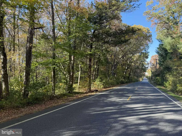 a view of house with outdoor space and lake view