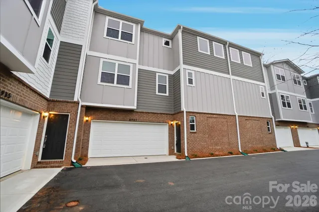 a front view of a house with a garage