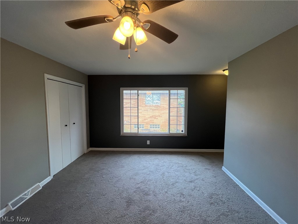 7475 Selwick Drive Parma, OH 44129 - Photo 14 of 29 Unfurnished room featuring carpet and ceiling fan