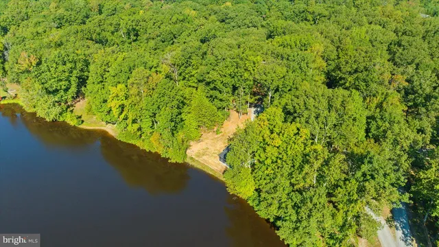 a front view of a house with a lake view