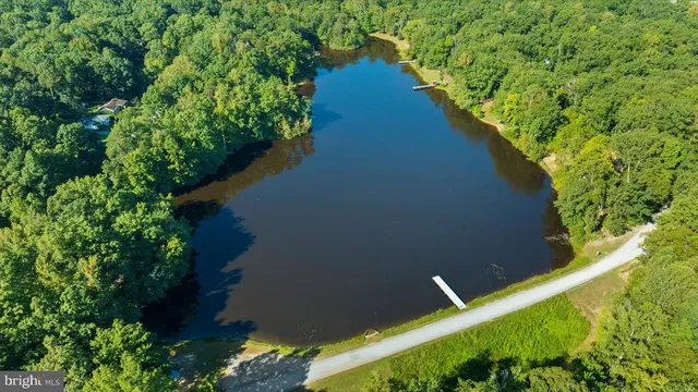 a view of a lake with a house in the background