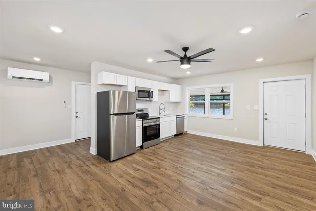 a kitchen with a refrigerator stove and microwave