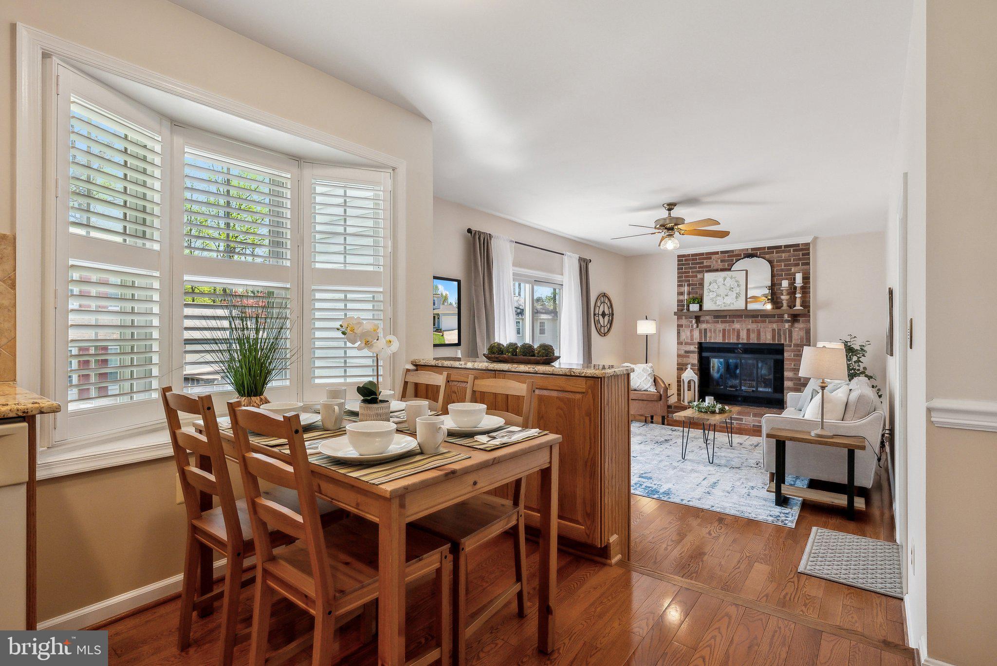 8312 Timber Brook Lane Springfield, VA 22153 - Photo 16 of 42 a view of a dining room with furniture window and wooden floor