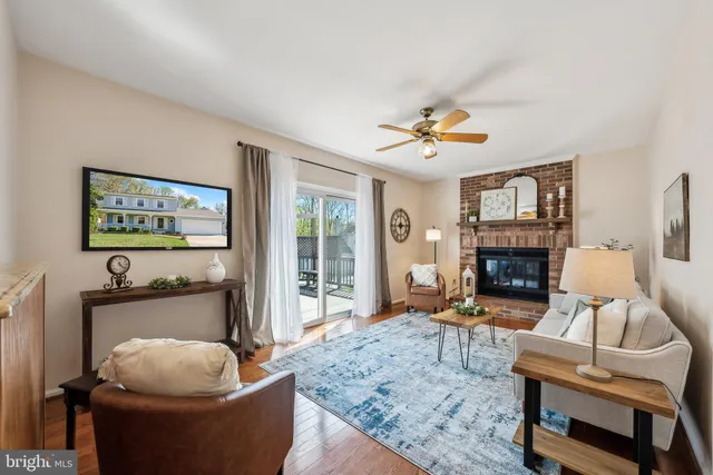 a living room with furniture a rug and a chandelier
