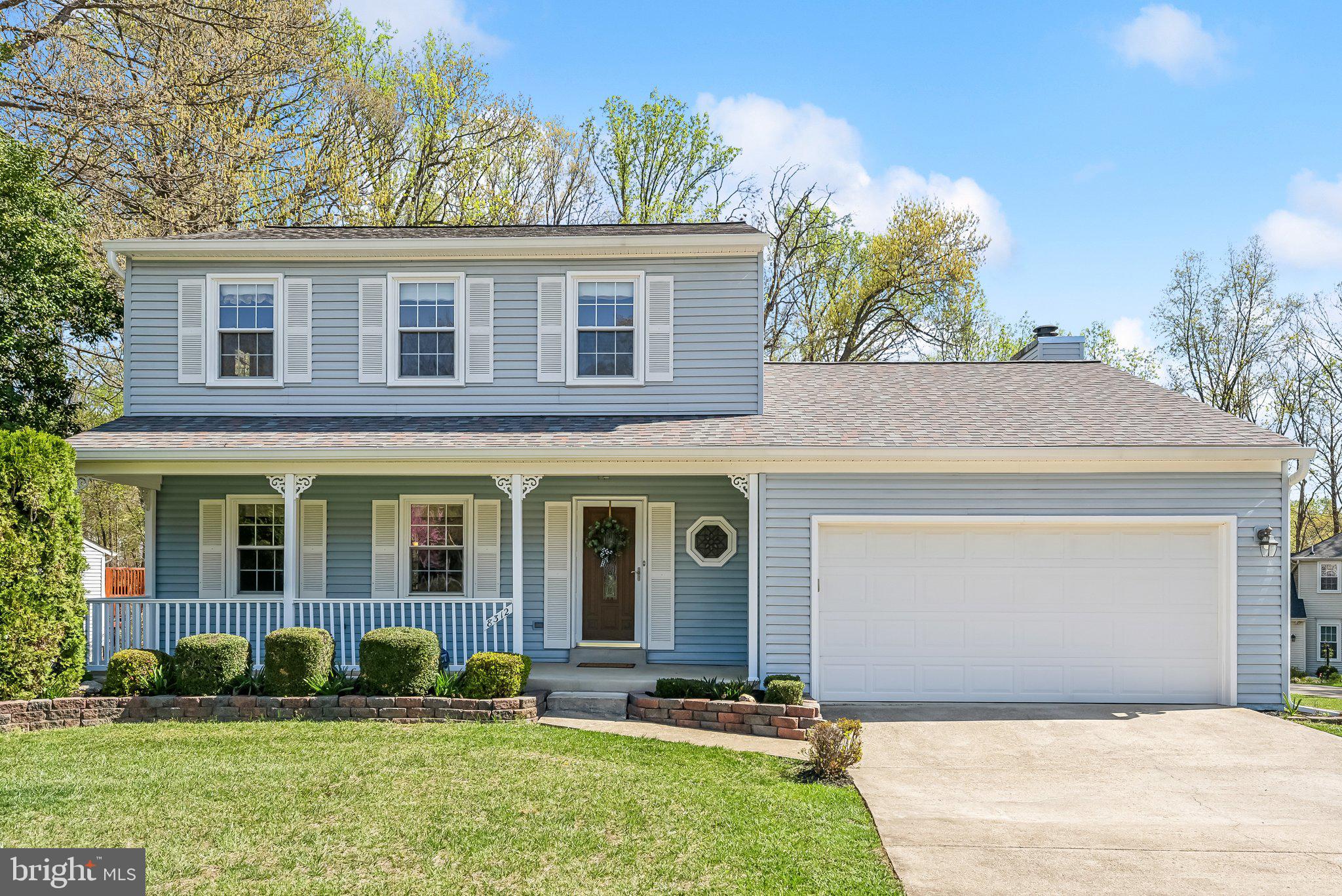 8312 Timber Brook Lane Springfield, VA 22153 - Photo 2 of 42 front view of a house with a yard