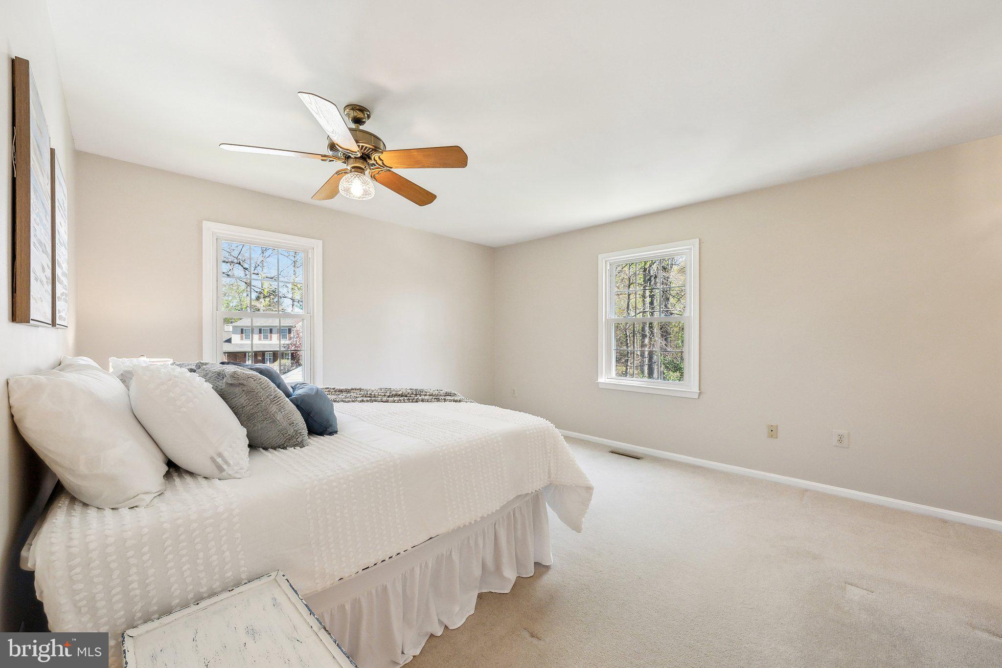 8312 Timber Brook Lane Springfield, VA 22153 - Photo 21 of 42 a bedroom with a bed and a window