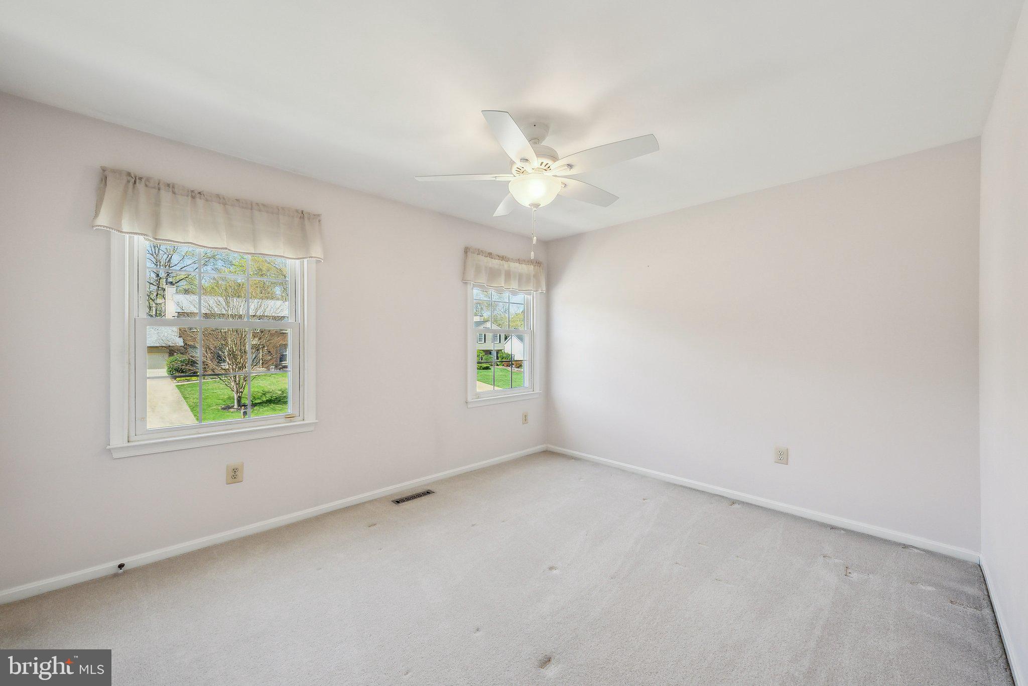 8312 Timber Brook Lane Springfield, VA 22153 - Photo 26 of 42 an empty room with a window and a fan