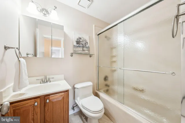 a bathroom with a sink a toilet and a bathtub