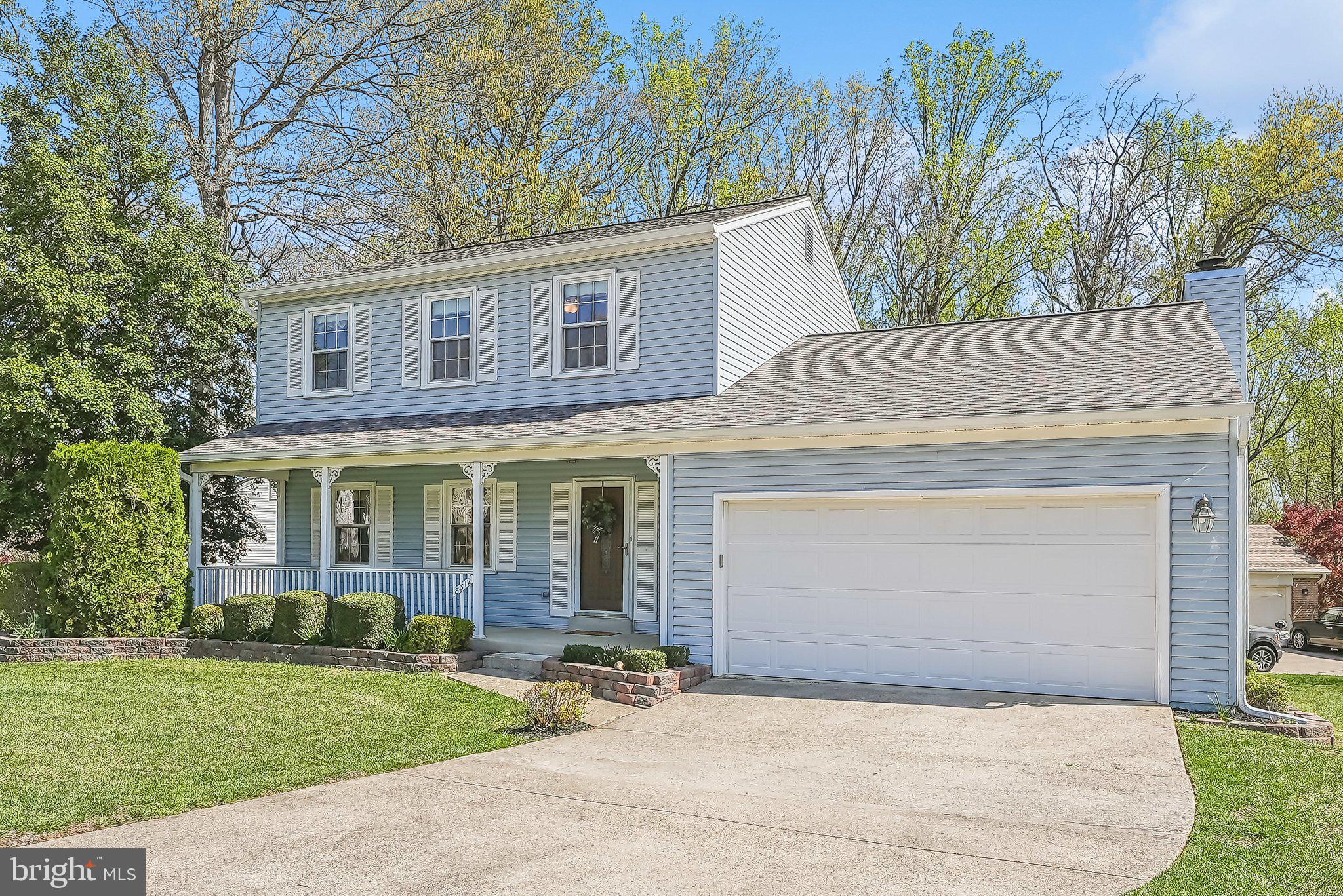 8312 Timber Brook Lane Springfield, VA 22153 - Photo 3 of 42 a front view of a house with garden