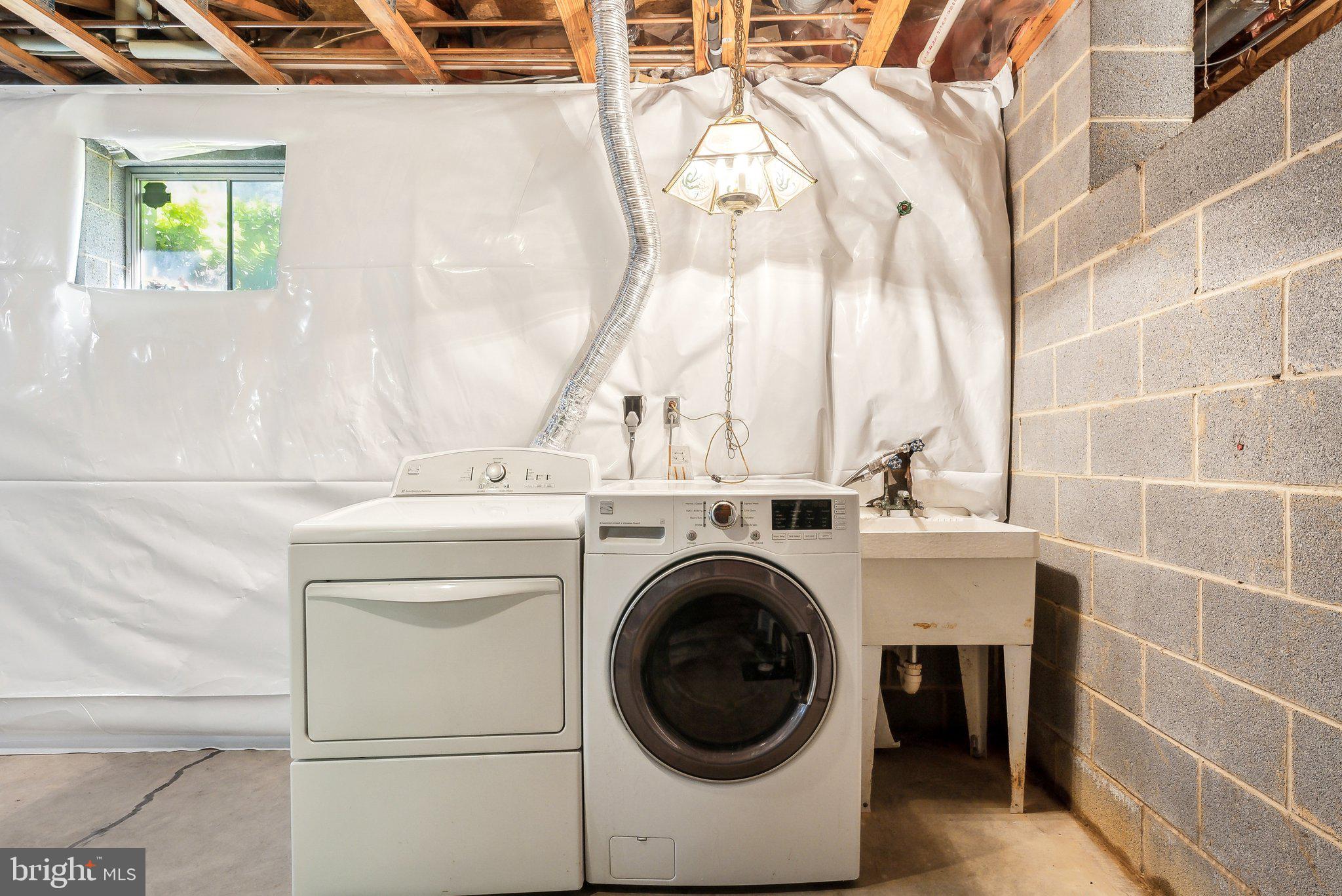 8312 Timber Brook Lane Springfield, VA 22153 - Photo 33 of 42 a utility room with dryer and washer