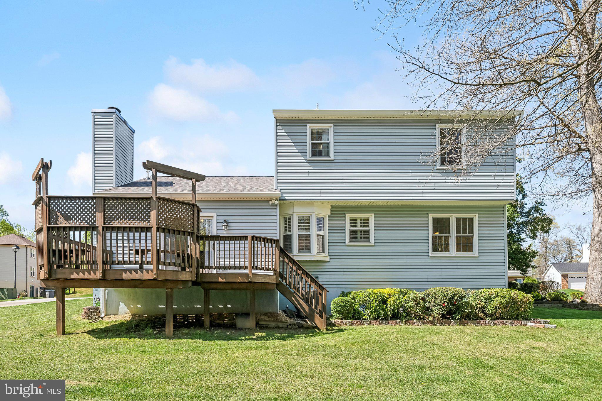 8312 Timber Brook Lane Springfield, VA 22153 - Photo 35 of 42 a view of a house with a yard
