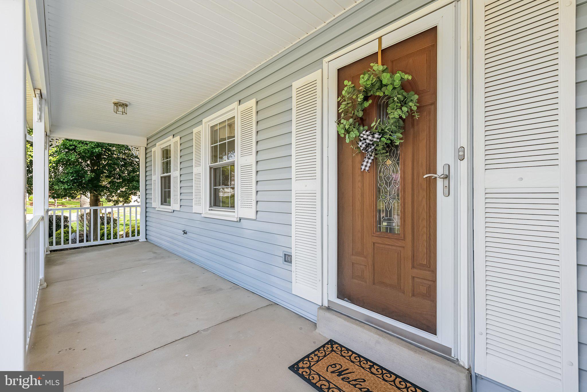 8312 Timber Brook Lane Springfield, VA 22153 - Photo 4 of 42 a view of a porch with a door and wooden floor