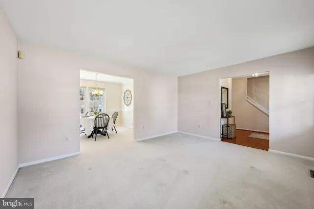 an empty room with mirror and a bench