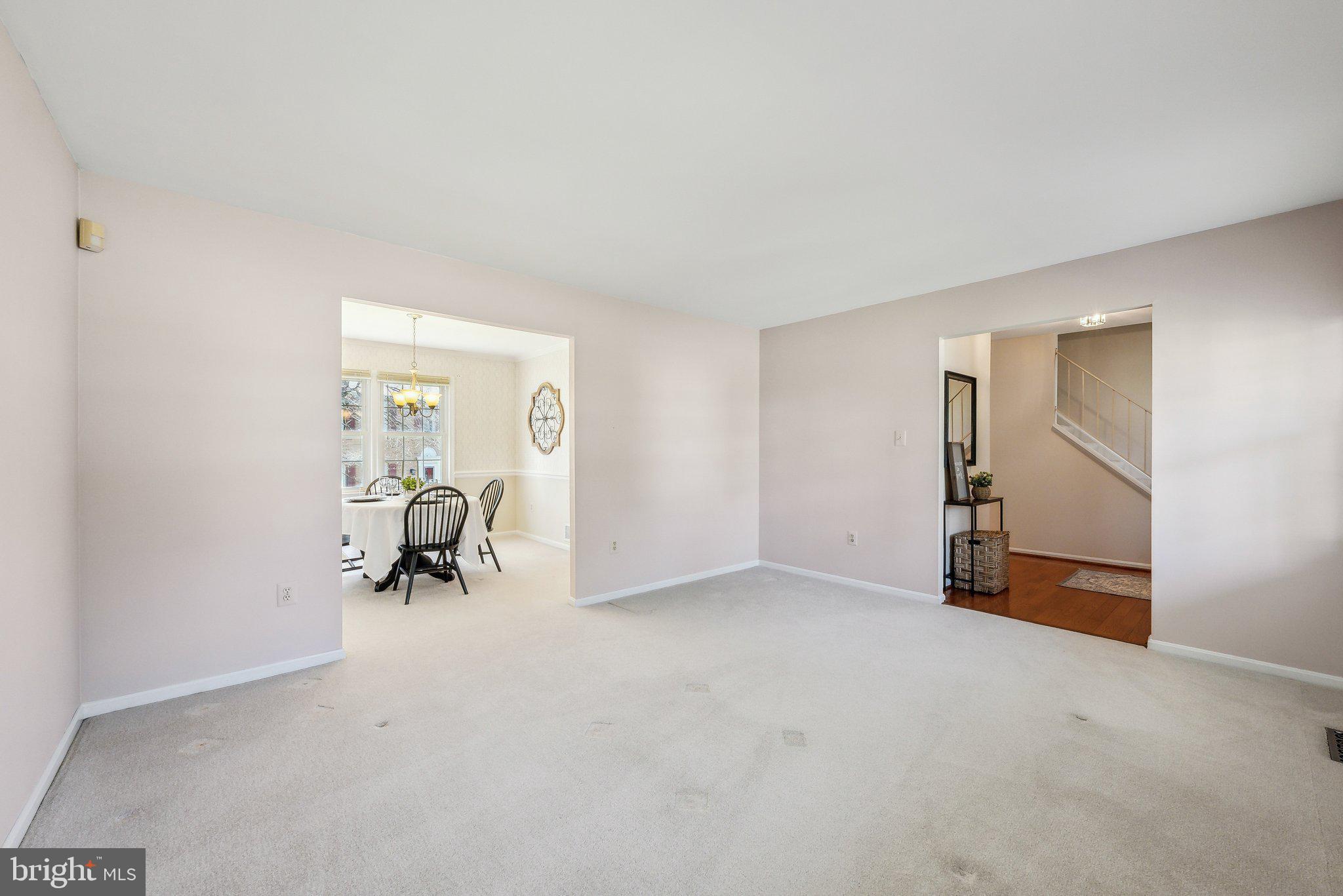 8312 Timber Brook Lane Springfield, VA 22153 - Photo 9 of 42 an empty room with mirror and a bench