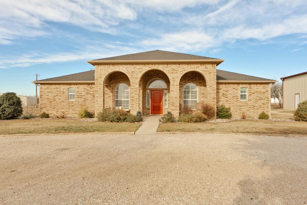 151 Conestoga Court Rhome, TX 76078 - Photo 1 of 38 a front view of a house with a yard