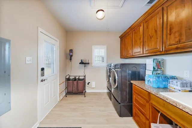 a kitchen with refrigerator and cabinets