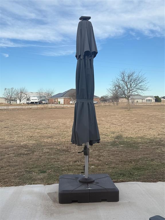 151 Conestoga Court Rhome, TX 76078 - Photo 38 of 38 a vase of water sitting next to a yard
