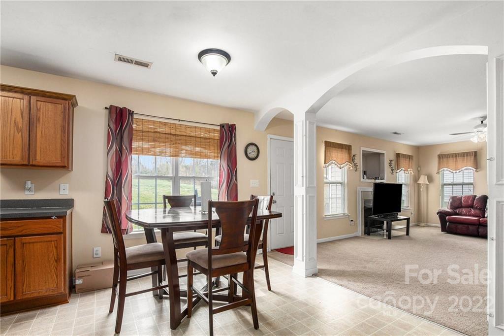 1222 Ben Livingston Road Charlotte, NC 28214 - Photo 13 of 32 a view of a livingroom with furniture and a window