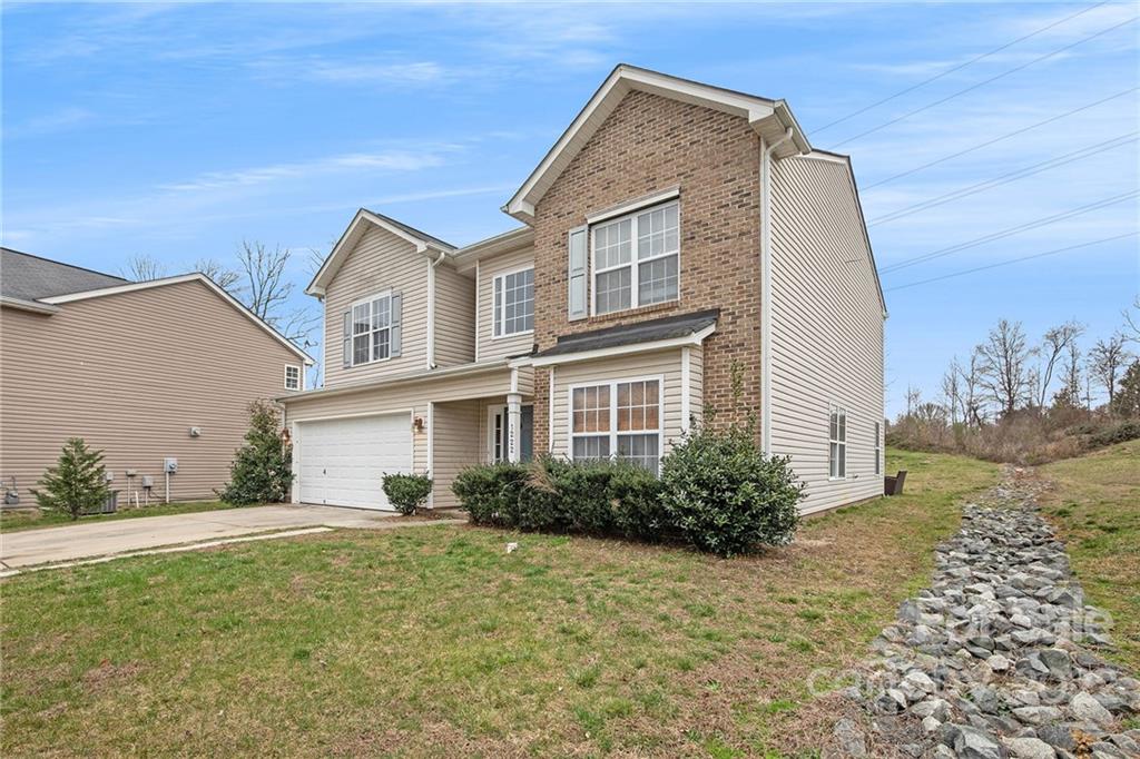 1222 Ben Livingston Road Charlotte, NC 28214 - Photo 2 of 32 a front view of a house with garden