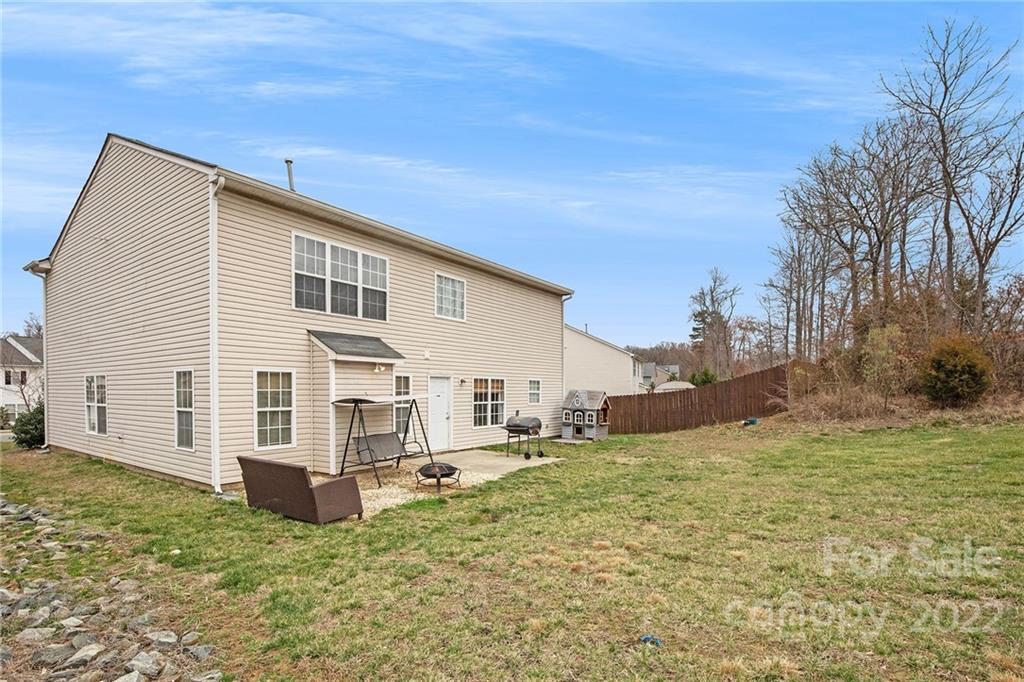 1222 Ben Livingston Road Charlotte, NC 28214 - Photo 31 of 32 a view of a house with a yard