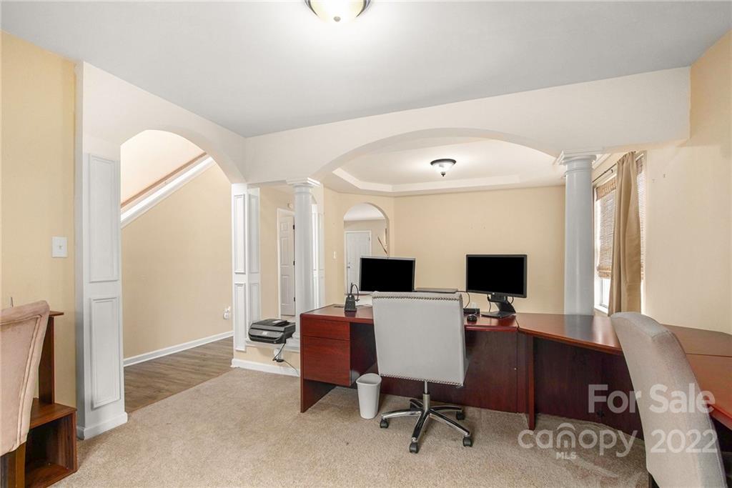 1222 Ben Livingston Road Charlotte, NC 28214 - Photo 7 of 32 a view of a workspace with furniture and a window