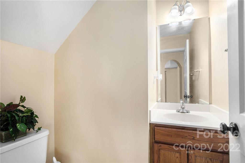 1222 Ben Livingston Road Charlotte, NC 28214 - Photo 8 of 32 a bathroom with a sink and a mirror
