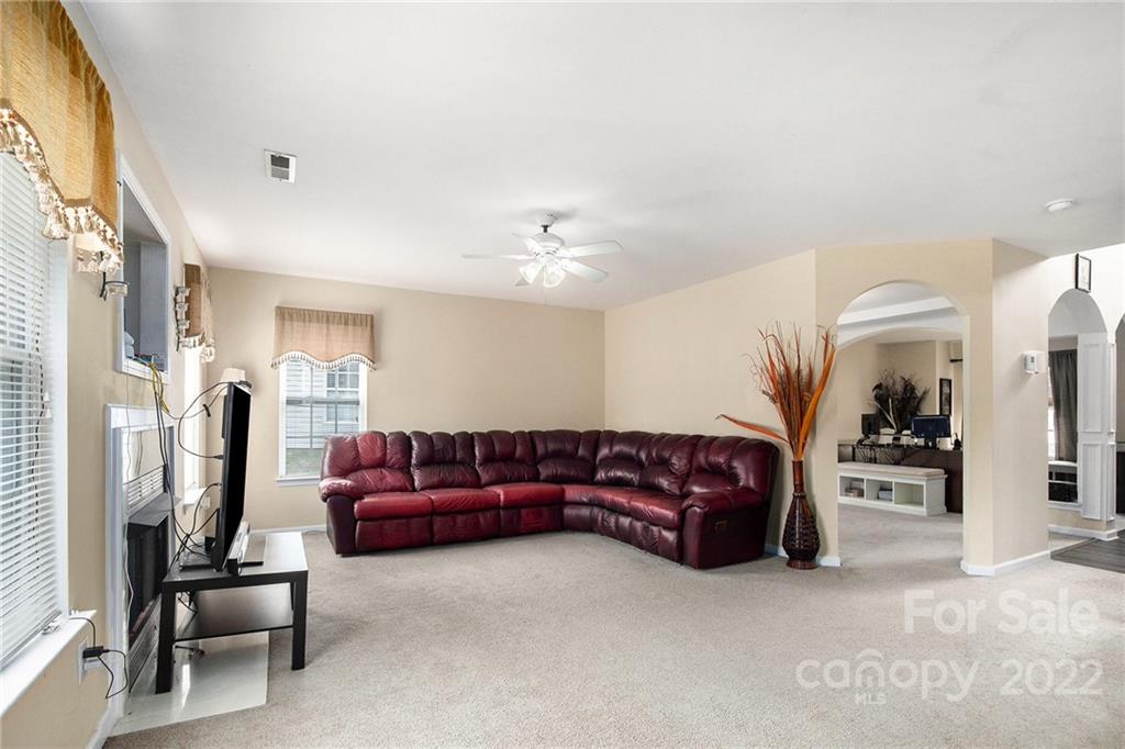 1222 Ben Livingston Road Charlotte, NC 28214 - Photo 10 of 32 a living room with furniture and a flat screen tv