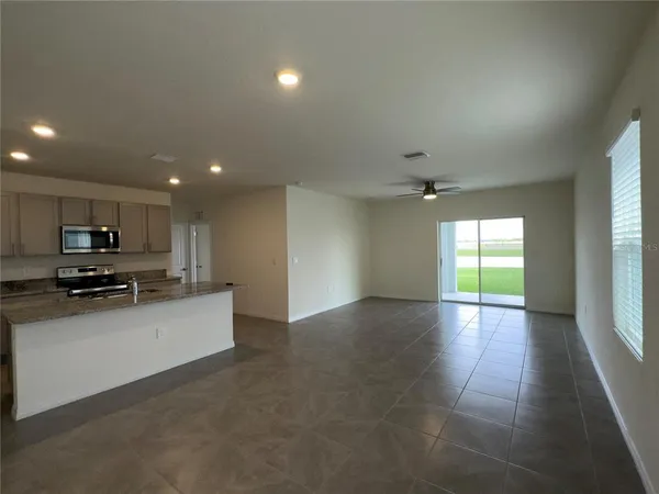 a view of a kitchen with a sink and a window