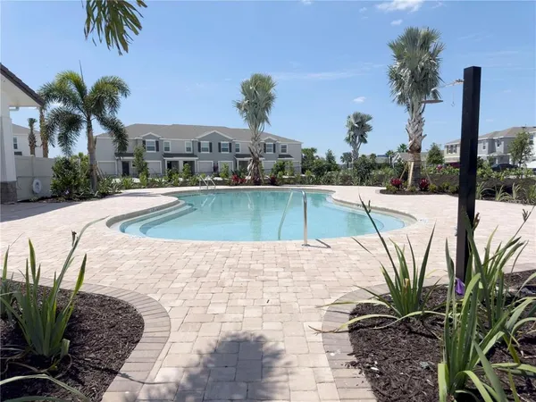 a view of a swimming pool with a lounge chairs